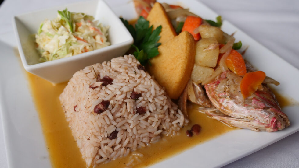 Steamed whole fish with rice and peas